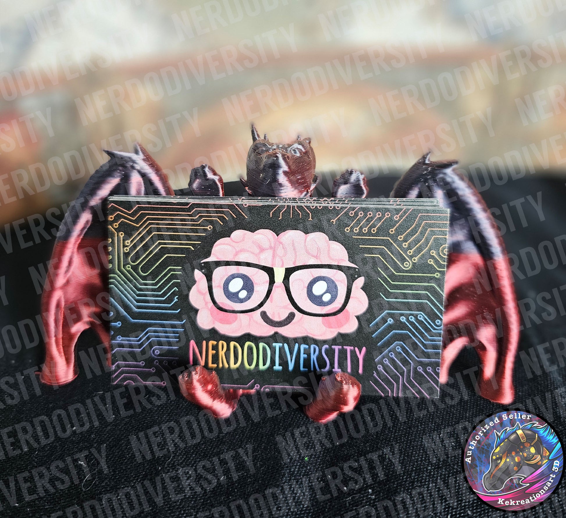 Helpful Dragon - Blood (holding Nerdodiversity business cards)