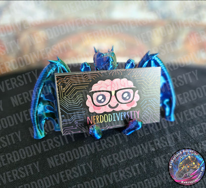 Helpful Dragon - Hologram (holding Nerdodiversity business cards)